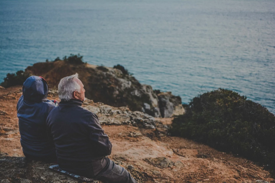 Couple looking out a sea